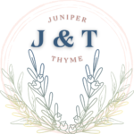 The blog Juniper & Thyme's brand logo of a circle with two juniper branches and two thyme branches at the bottom of the circle. The blog's initials is at the top middle of the circle.