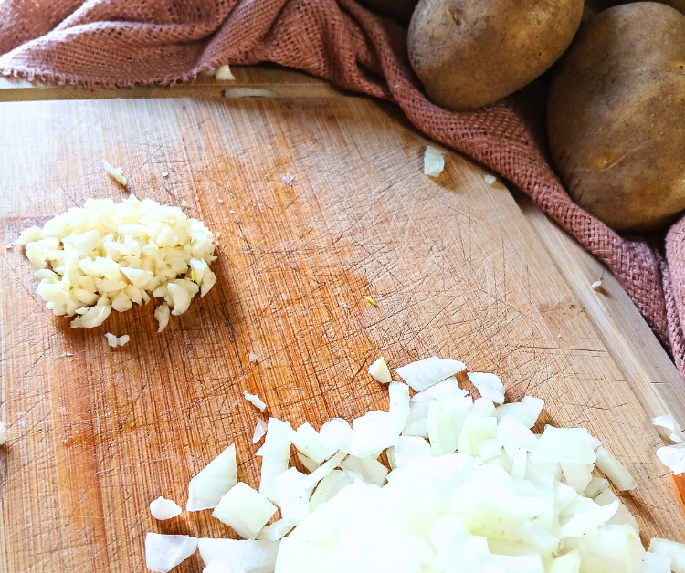 chopped up onions and garlic for soup